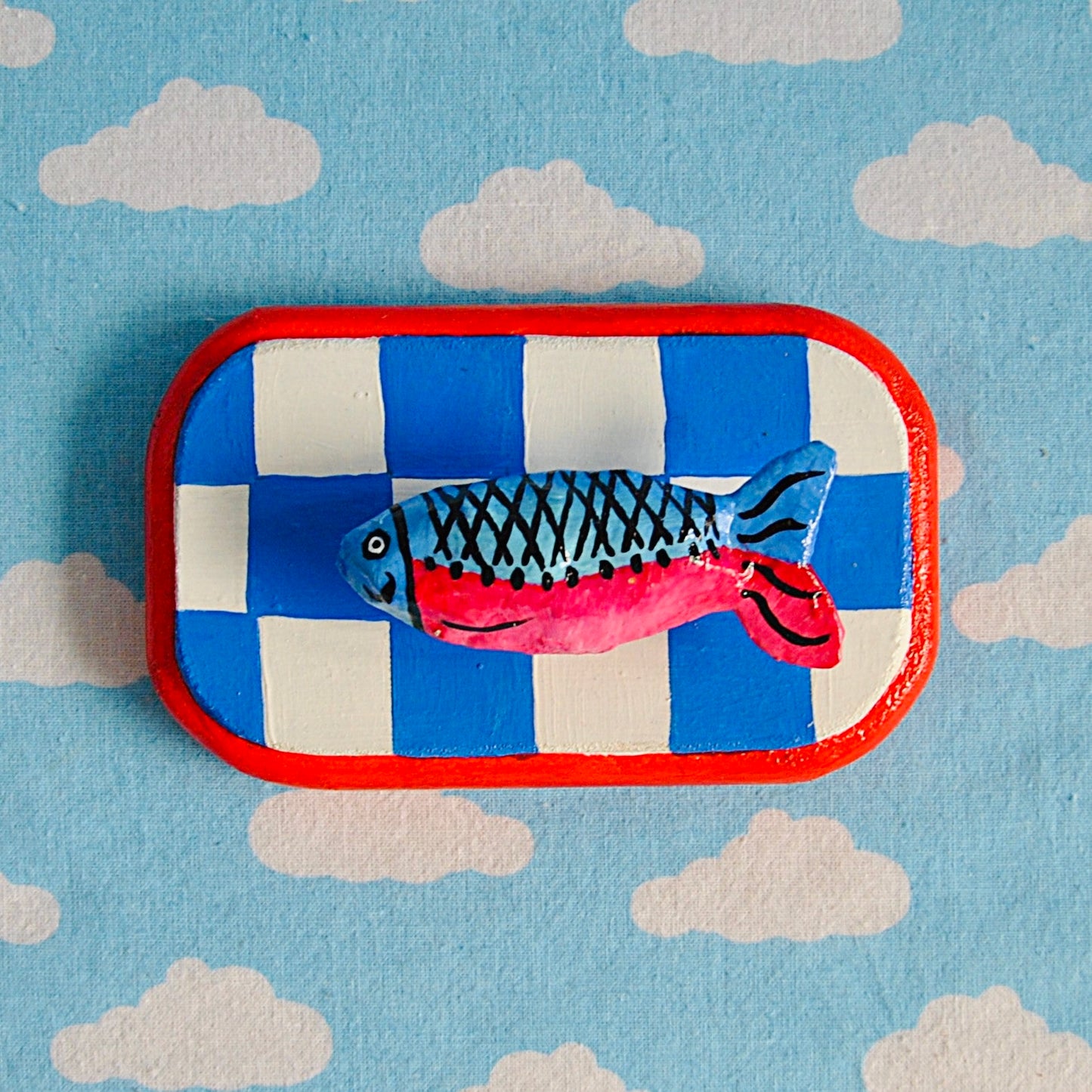 Tiny fish on checker board