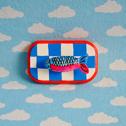 Tiny fish on checker board