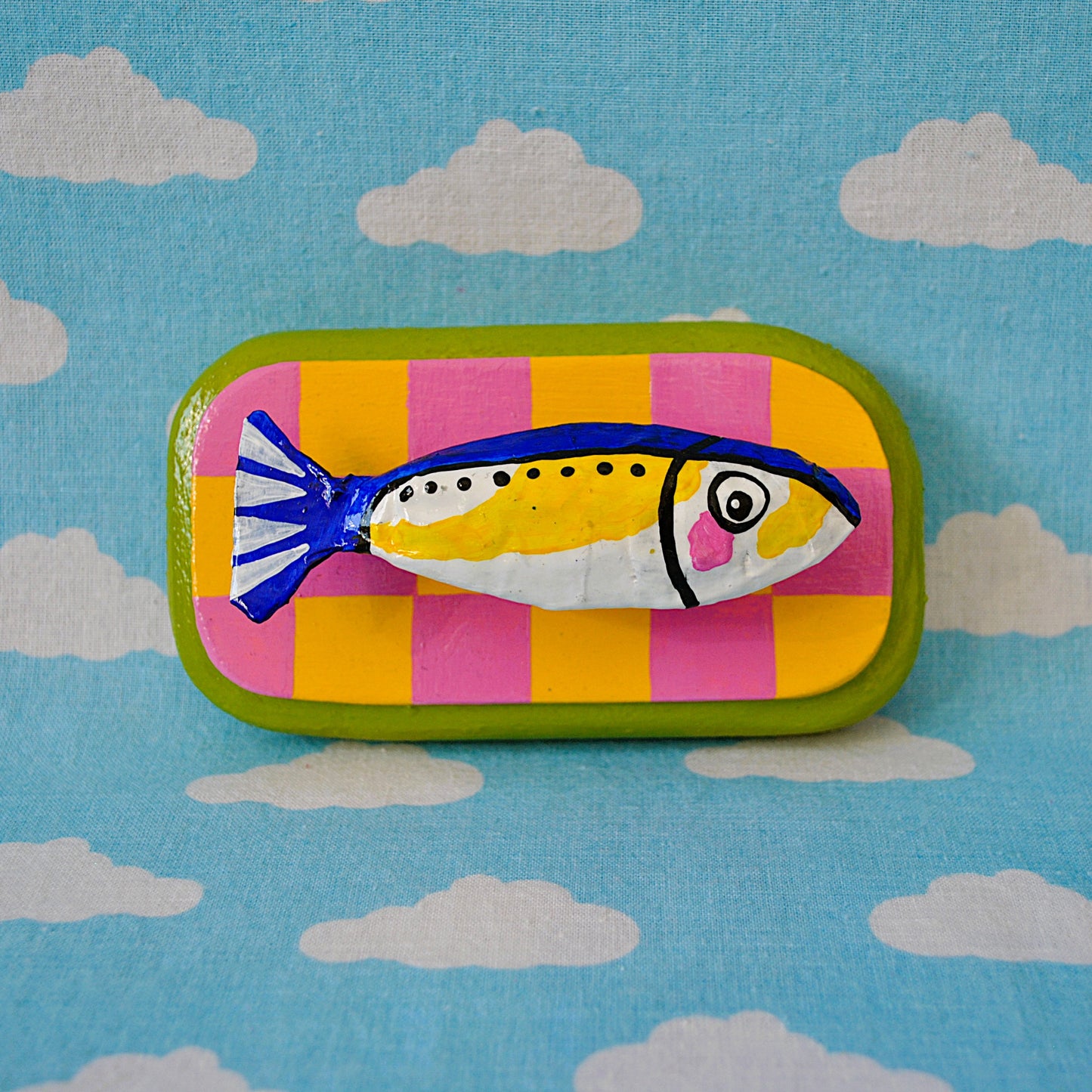 Sardine on Pink and Yellow Checker Board