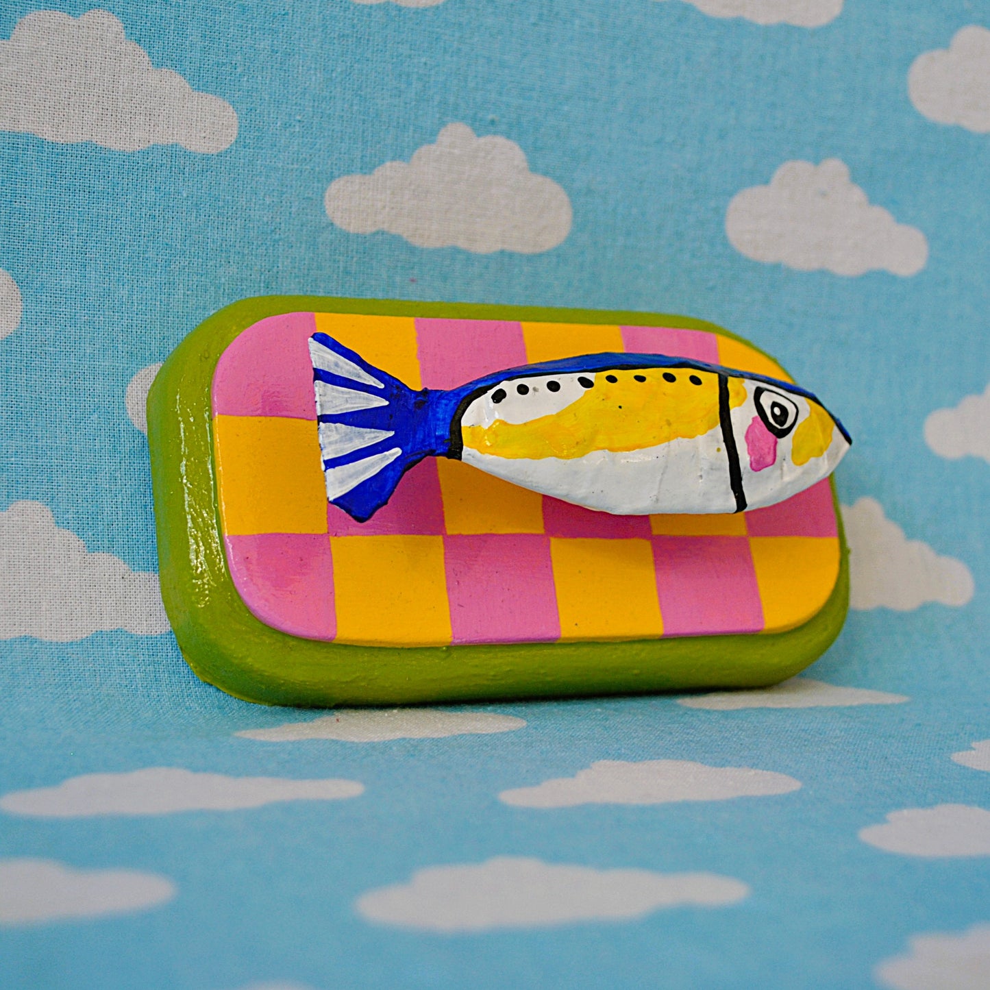 Sardine on Pink and Yellow Checker Board