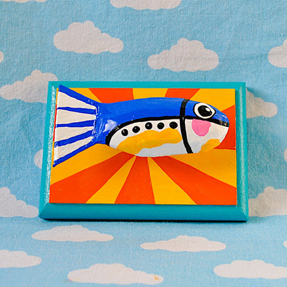 Sardine on yellow and orange