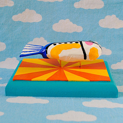 Sardine on yellow and orange